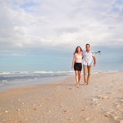 Engaged couple on the beach at Washington Oaks Gardens.